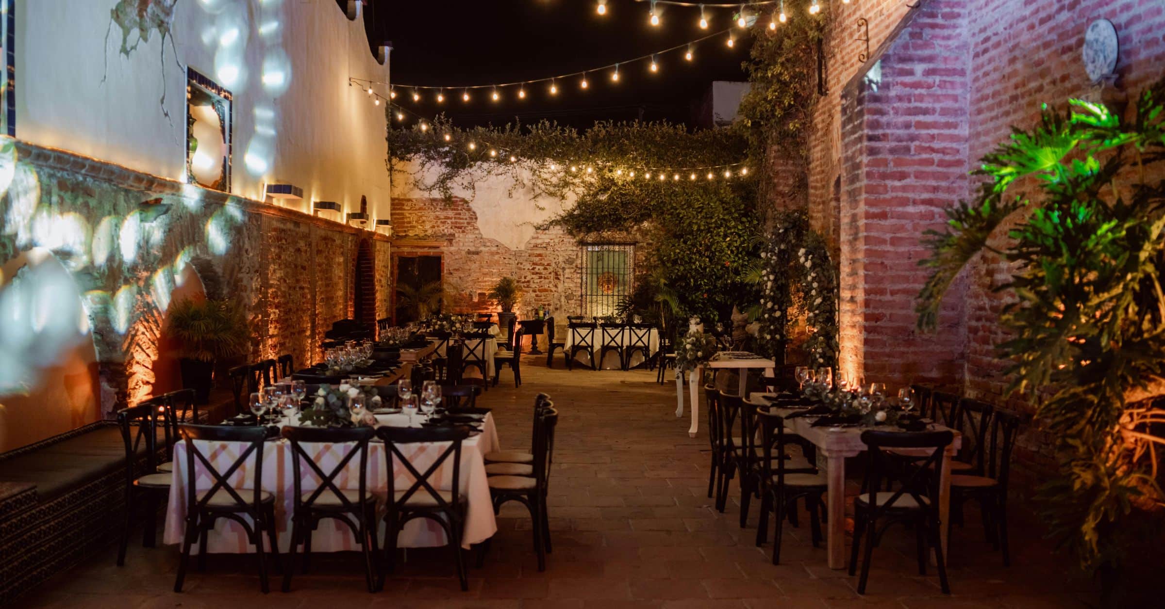 Outdoor Evening Event with Elegant Decor Under String Lights View more by Angel Ayala from Pexels (Permanent Lights on House): How to Instantly Upgrade Your Curb Appeal Year-Round