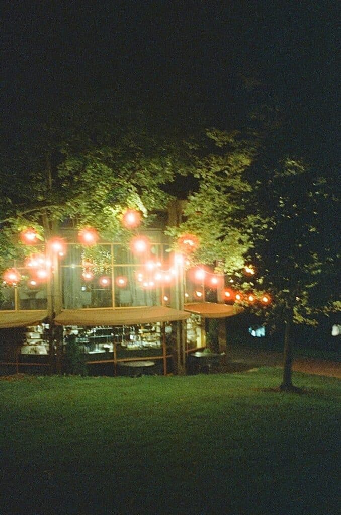 A lit up gazebo in a park at night