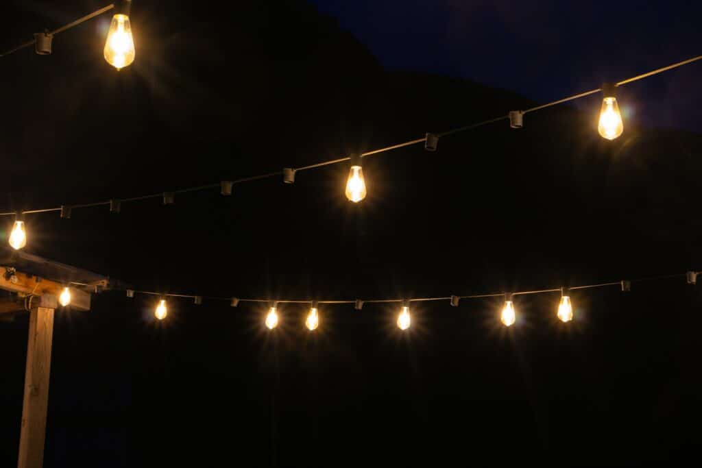 String lights glow against a dark night.