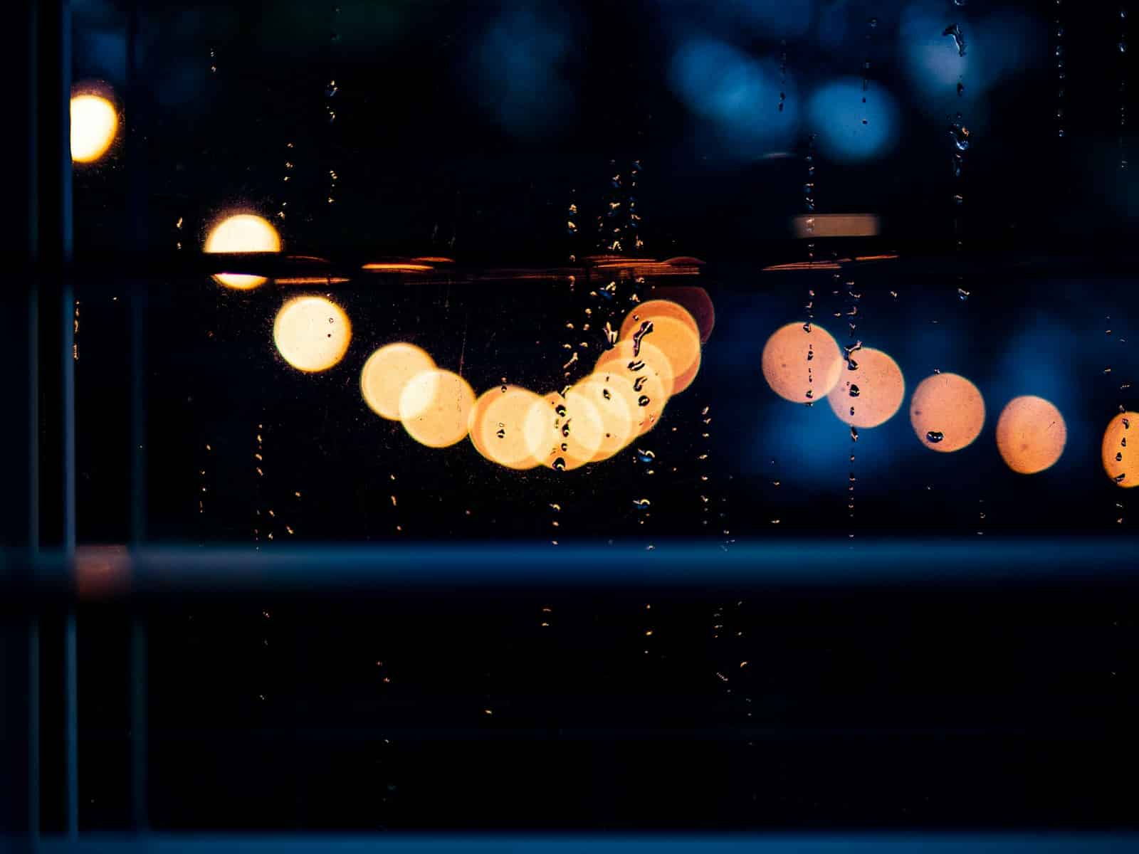 A blurry photo of a rain covered window LED Christmas Lights Outdoor