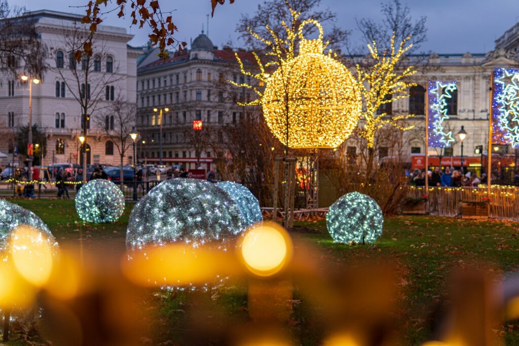 green and yellow christmas tree with string lights