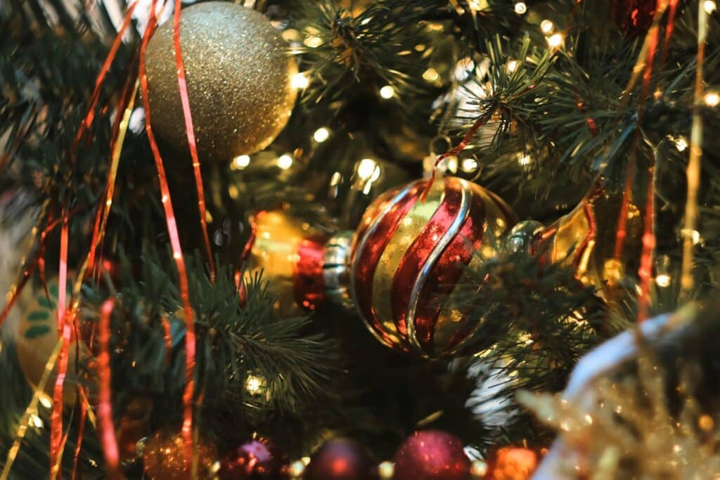 a close up of a christmas tree with ornaments
