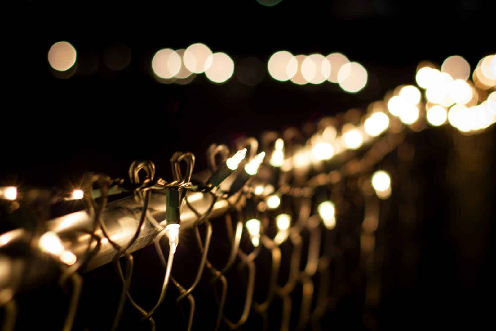 a bunch of lights that are on a fence Govee Lights