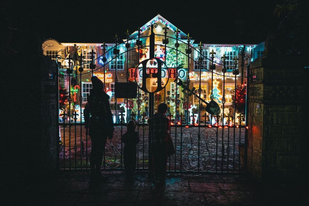a couple of people that are standing in front of a gate