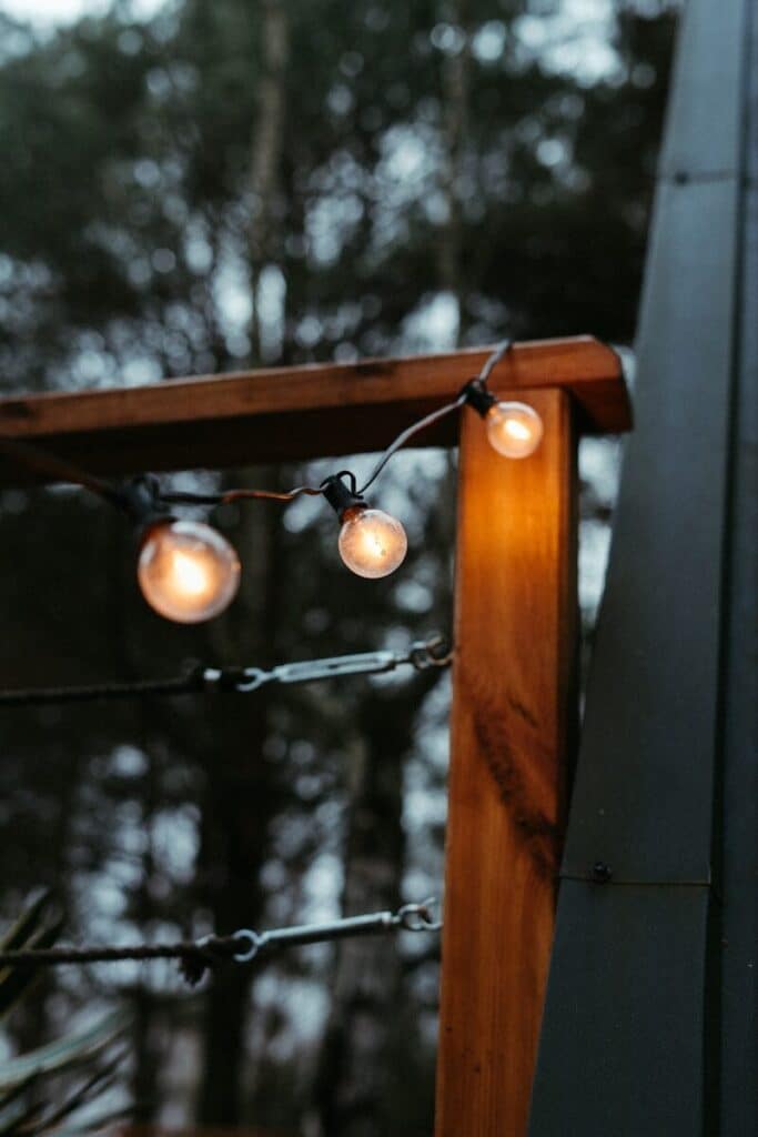 a string of lights hanging from the side of a building