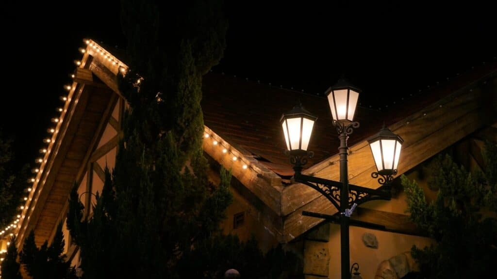 Streetlights illuminate a building at night
