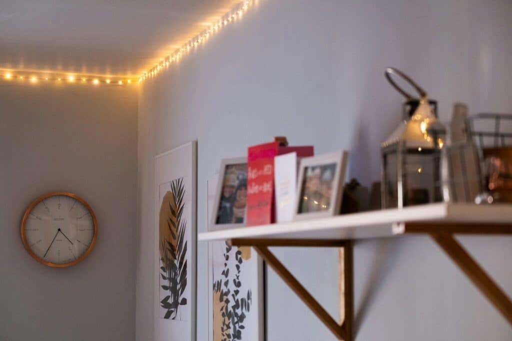 red and white box on white wooden shelf