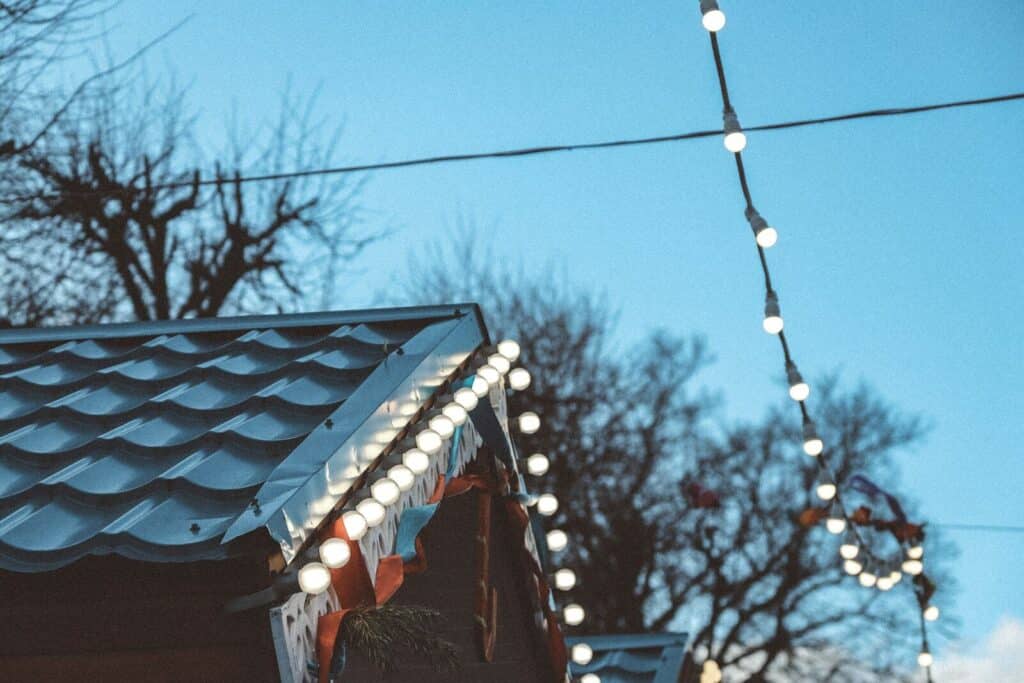 brown wooden roof with string lights