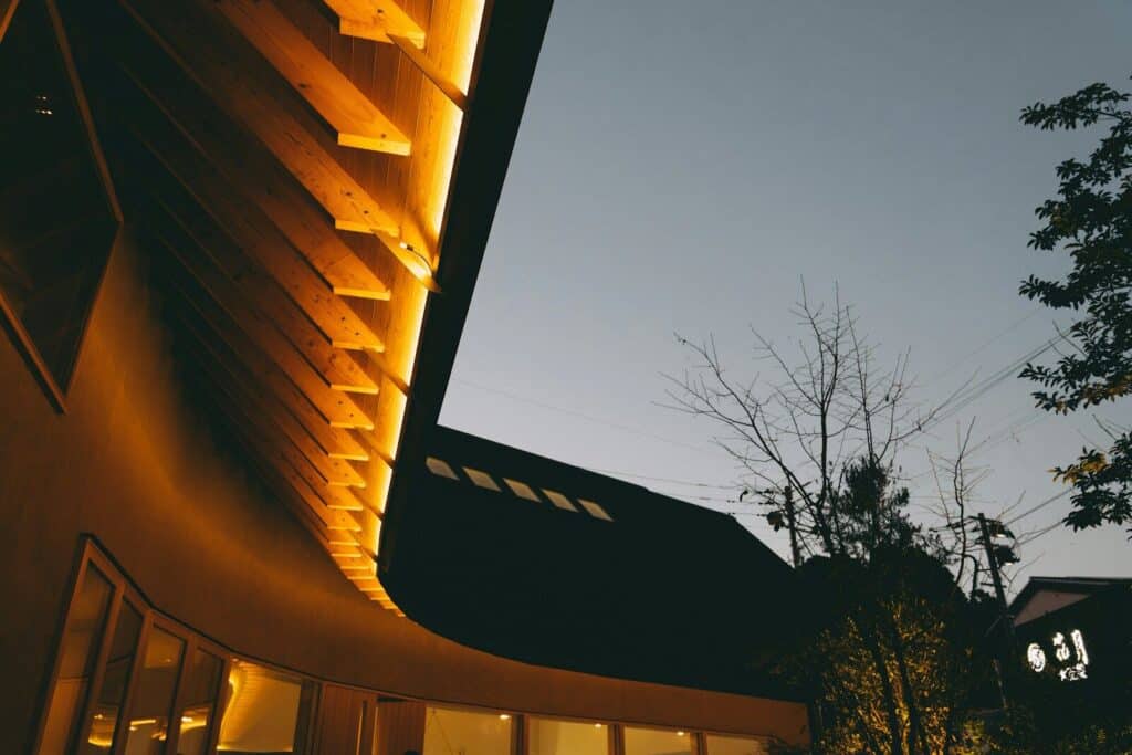 Modern building exterior with warm ambient lighting at dusk