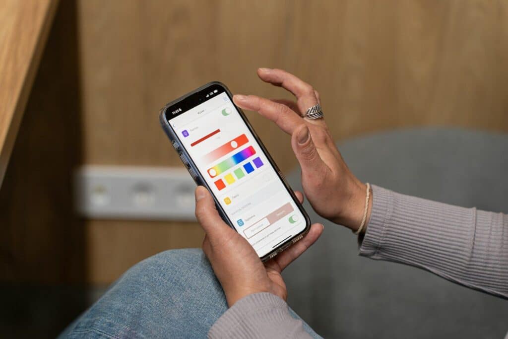 Adjusting smart home lighting settings on a mobile phone.
